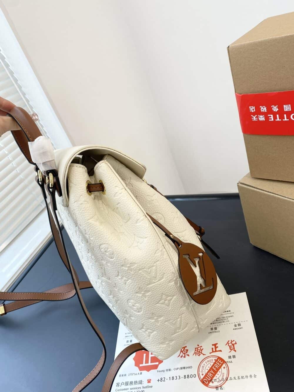 LOUIS VUITTON MONTSOURIS BACKPACK EMPREINTE WHITE AND BROWN 25CM - Image 8