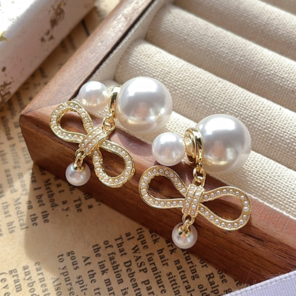 Alternative view of DIOR TRIBALES EARRINGS IN BOW SHAPED WITH PEARLS GOLD E3630WOMCY D03S