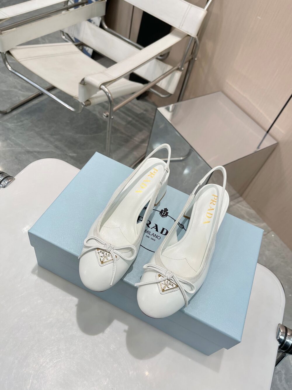 PRADA TRIANGLE LOGO BOW SLINGBACK PUMP IN WHITE - Image 3